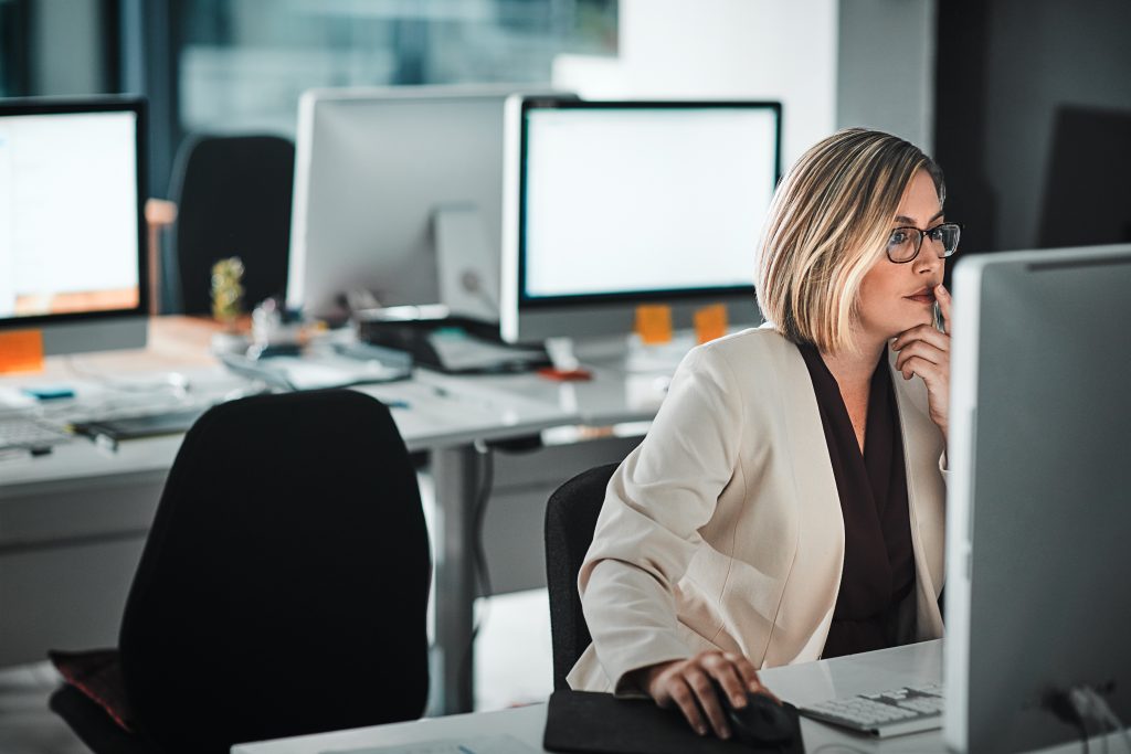 Concentrating at desk with computer