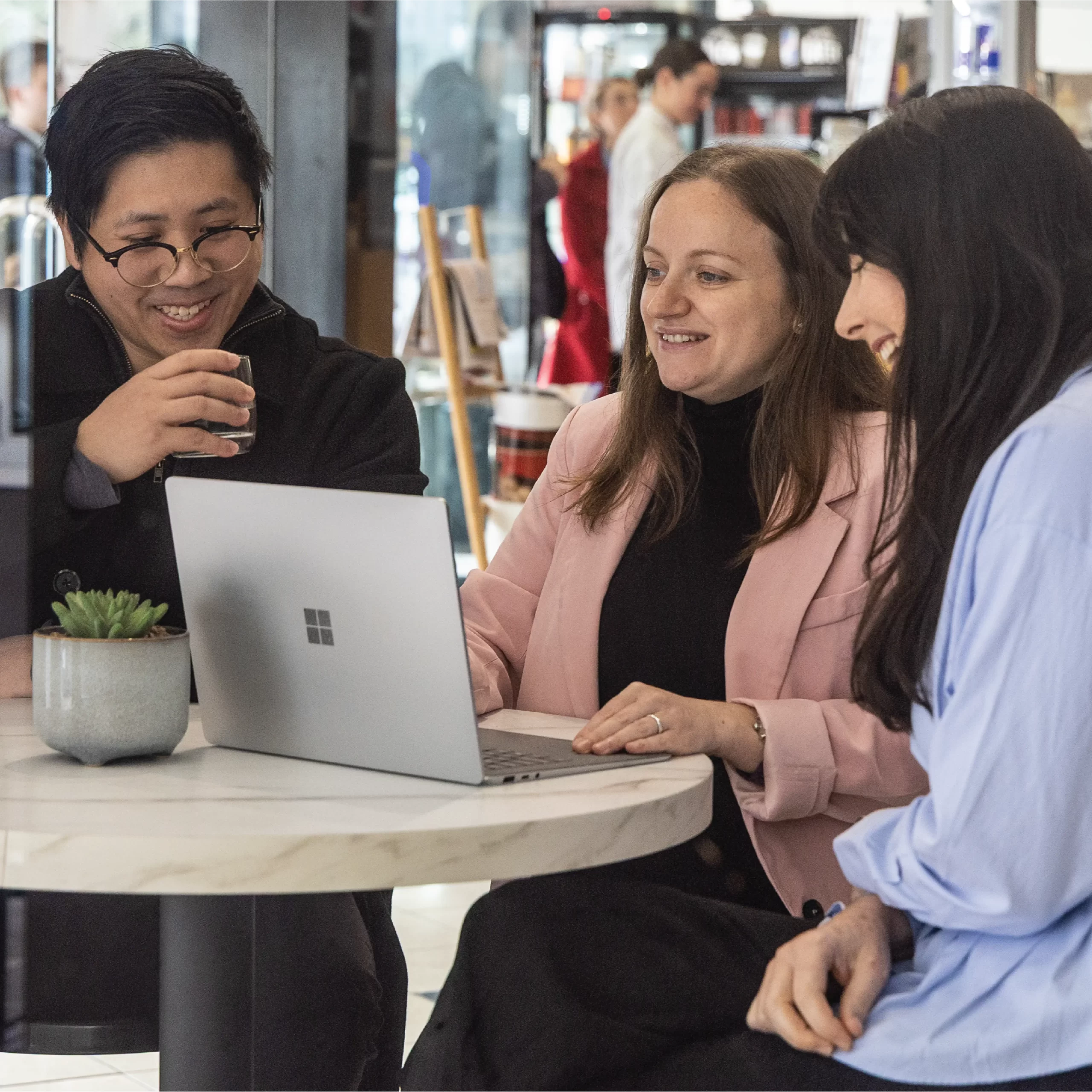 3 of Lanters staff working in a cafe.